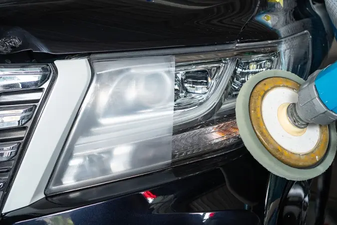 Headlight restoration showing clear versus hazy lens